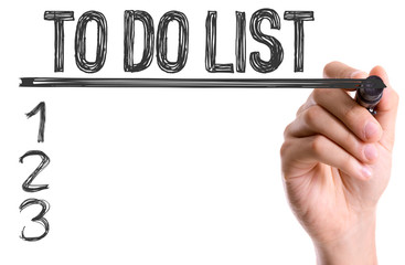 Hand with marker writing: To Do List