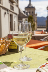 Enjoying a cool white wine at a cafe in Escorial, Spain