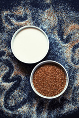 Cane and white sugar in a porcelain bowl, top view, selective fo