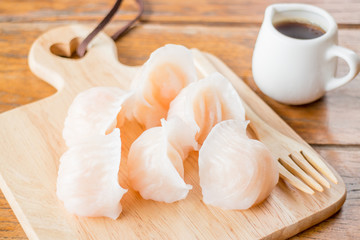 Chinese har gao dim sum dumplings on wooden plate