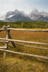 Fototapeta na wymiar Late summer mountains, fence, in Grand Teton National Park, Wyom