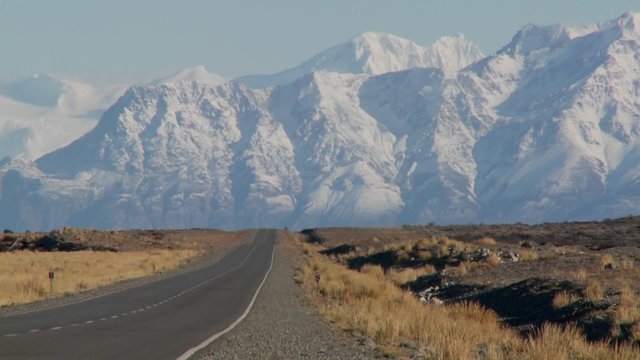 An empty road heads into the remote Andes region of Patagonia.