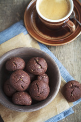 Italian chocolate cookies with walnuts and a cup of coffee 