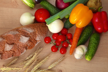 Pile of organic vegetables on a wooden table