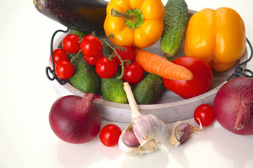 Fresh autumn vegetables on a white background