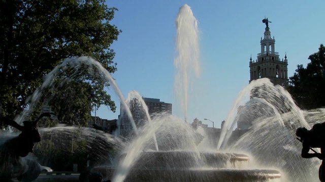 A downtown fountain in Kansas City with buildings background.