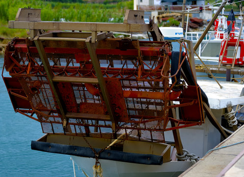 fishing boat in the harbor of Foce Varano coastal seaside resort of Gargano National Park. Puglia. ITALY