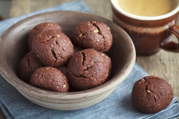 Italian chocolate cookies with walnuts and a cup of coffee 
