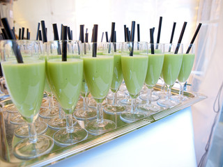 fruit smoothie glasses in rows