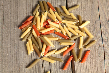 Raw homemade pasta and ingredients for pasta on wooden