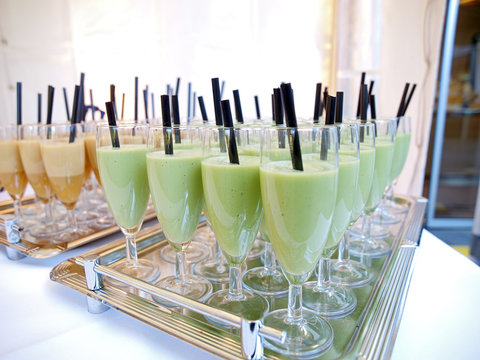 fruit smoothie glasses in rows
