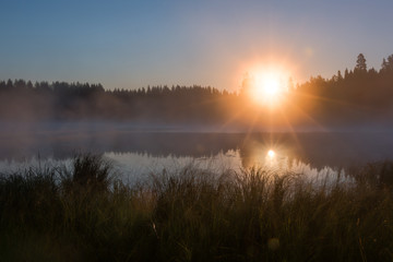 HDR shot of foggy sunrise at a lake