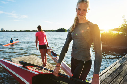 Fit woman with a kayak