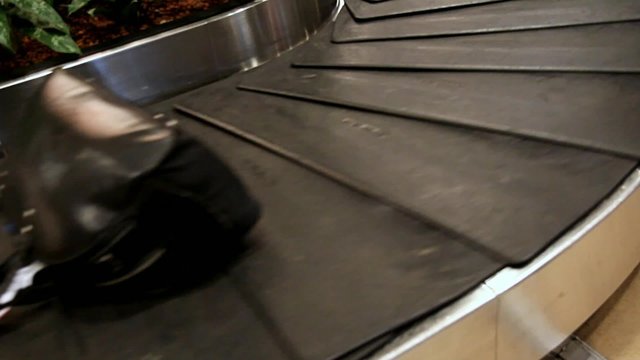 luggage on the conveyor in the airport
