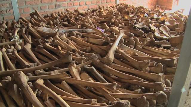 Leg bones of skeletons in long rows offer a grim remembrance of the Rwanda genocide.
