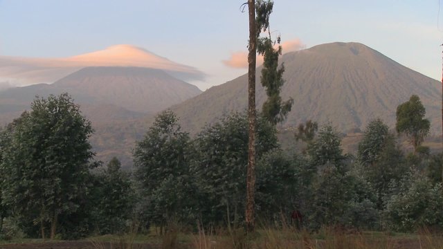 A strange cloud formation forms at the summit of the Virunga volcano chain on the Rwanda Congo border.