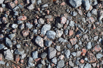Red and gray pebble stones on the ground