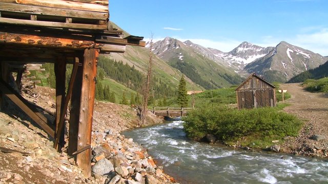 Colorado ghost town with river flowing.