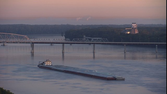 Mississippi river barge moving down river
