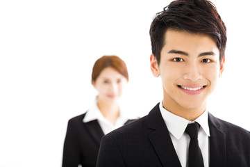 happy businessman and woman standing  in office