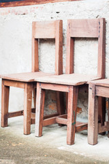 Fototapeta na wymiar Wooden chairs in garden