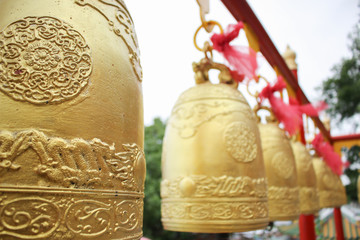 Golden bell and red ribbon