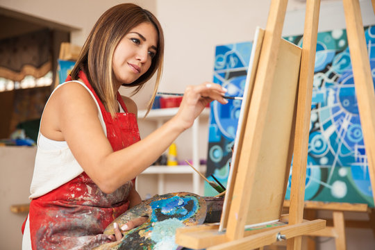 Female artist working in a studio