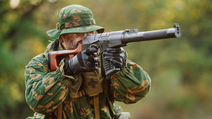 Fototapeta premium russian soldier in the battlefield with a rifle