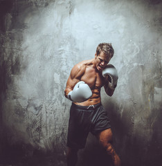 Muscular shirtless fighter.