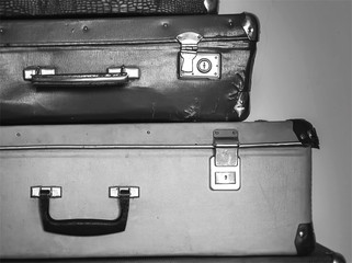 Vintage travel concept with baggage on black and white colors.