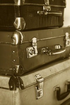 Vintage travel old suitcases, monochromatic photo in retro style