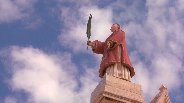 Clouds drift behind St. Maron of the Maronite Catholic Church of Lebanon.
