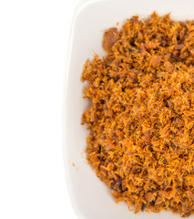 Malaysian dish of shredded fish floss or locally known as Serunding Ikan in a white bowl 