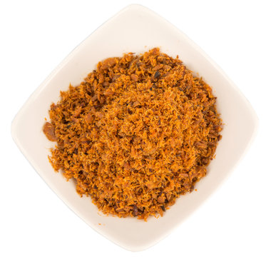Malaysian dish of shredded fish floss or locally known as Serunding Ikan in a white bowl 