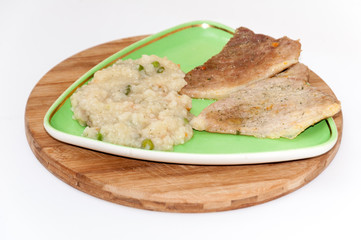 Pork meat with risotto in the plate