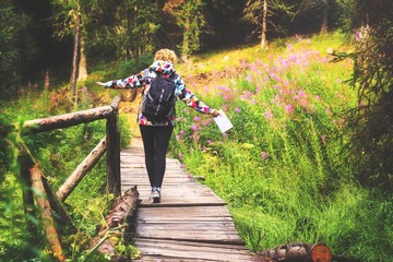 Young woman enjoying a hike through the forest.
