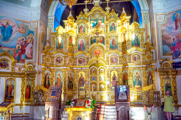 Fototapeta na wymiar Interior of russian orthodox church. Iconostasis in Saint Michael's Cathedral, Izhevsk, Udmurtia, Russia.