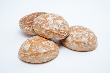 Four gingerbread cookies on white background