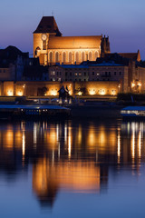 Fototapeta premium Torun Cathedral with Reflection on Vistula River