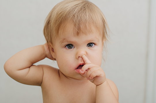 Premium Photo  Nose picking. child picking his nose close up