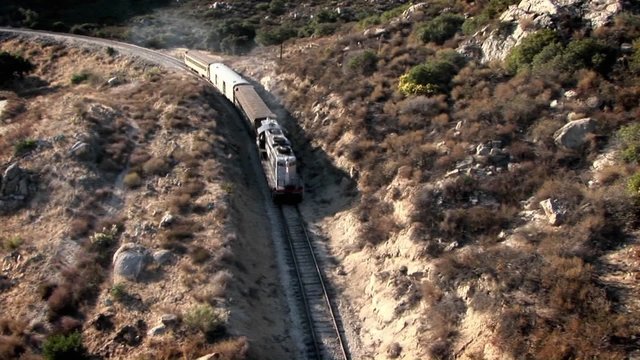 A train travels through a mountainous area.