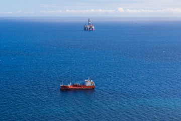 Oil production into the sea from above.