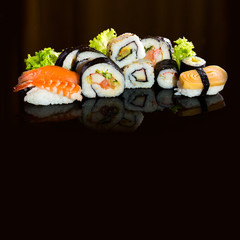 Sushi collection, isolated on black background.