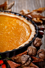 Pumpkin pie on a rustic table 