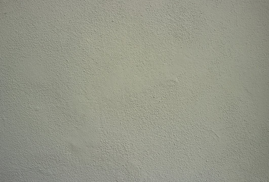 Braungraue Wand mit Strukturputz