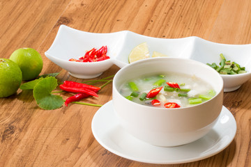rice gruel in bowl on wooden