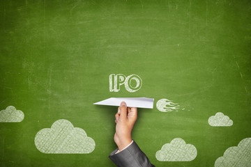 IPO concept on blackboard with paper plane