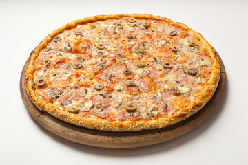 Tasty pizza on wooden board