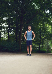 Athletic Man at the Park with Hands on Waist