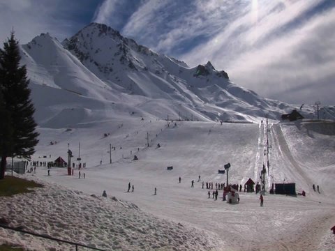 People are preparing to ski at a mountain resort.